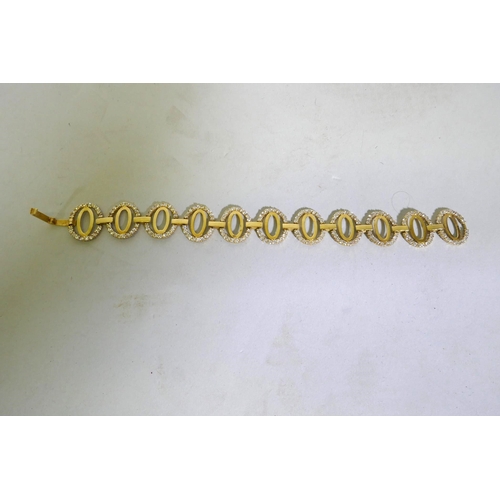 630 - An 18ct Arab gold link bracelet set with white crystals, 18cm long