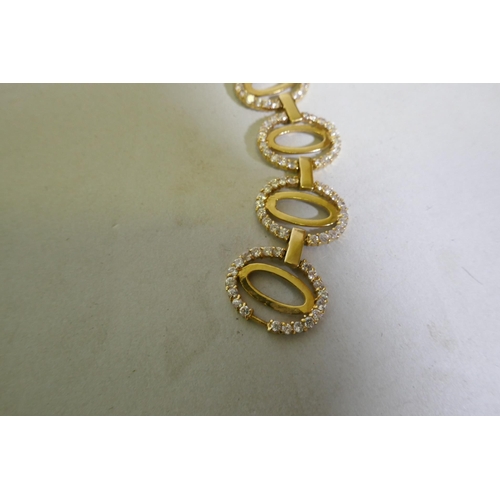 630 - An 18ct Arab gold link bracelet set with white crystals, 18cm long