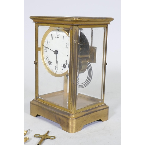 633 - A C19th/C20th brass four glass mantel clock, the porcelain dial with Arabic numerals, inscribed Anso... 