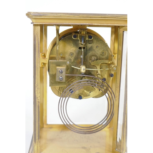 633 - A C19th/C20th brass four glass mantel clock, the porcelain dial with Arabic numerals, inscribed Anso... 