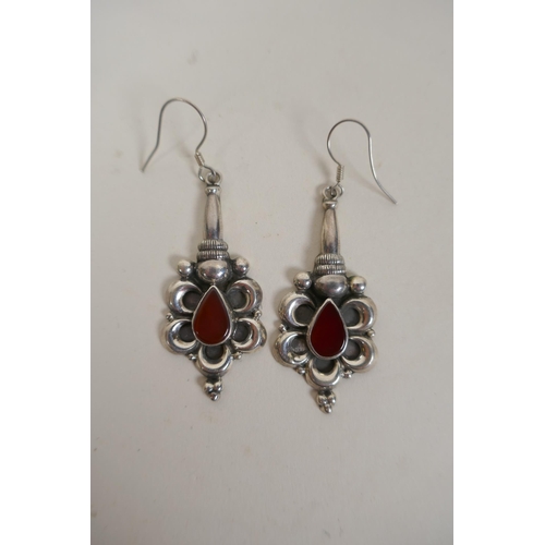 636 - A pair of 925 silver earrings set with red stones, 5cm drop