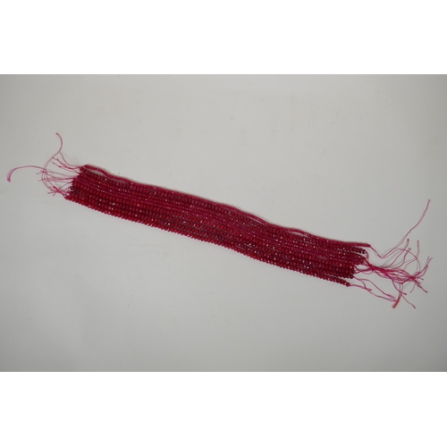 640 - Nine bead strings of faceted ruby coloured hardstone, assorted sized strands, 39cm long