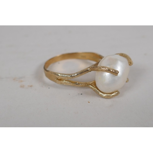 657 - A pair of faux pearl 'Jackie's' (Kennedy) replica earrings, and a 9ct gold ring set with a large pea... 