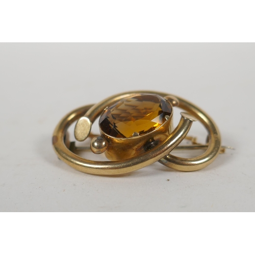 661 - An antique yellow metal brooch set with a large citrine stone, 11g groos