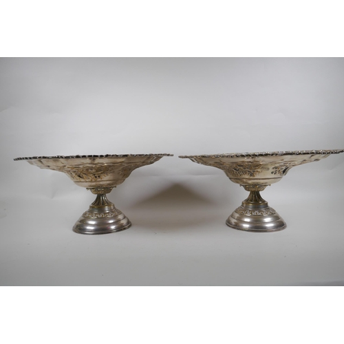 671 - A pair of Victorian Walker and Hall silver plated tazza, and a pair of silver plated fighting cocks,... 