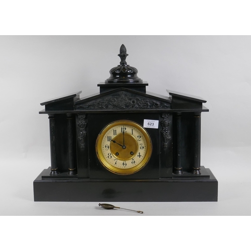 672 - A C19th slate mantel clock of classical form, with carved decoration to the pediment and brass dial ... 