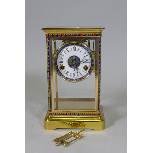 676 - A polished brass four glass mantel clock with inset cloisonne panels, enamel dial and French movemen... 