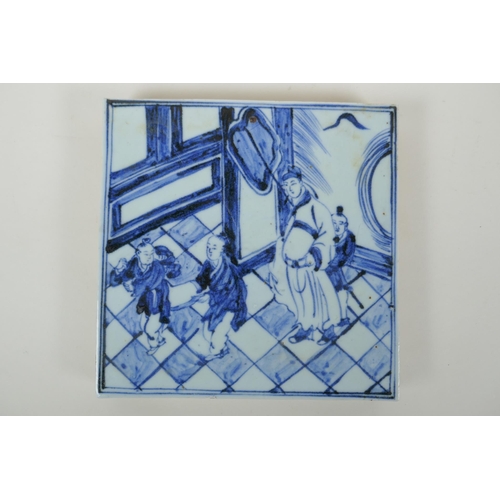 68 - A Chinese blue and white porcelain temple tile depicting a scholar and children, 20 x 20cm