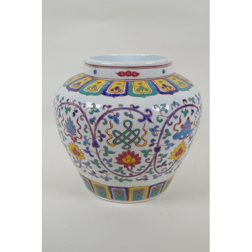 70 - A Chinese polychrome porcelain jar with enamel decoration of flowers and the eight Buddhist treasure... 