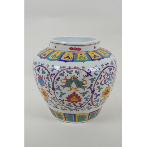 70 - A Chinese polychrome porcelain jar with enamel decoration of flowers and the eight Buddhist treasure... 