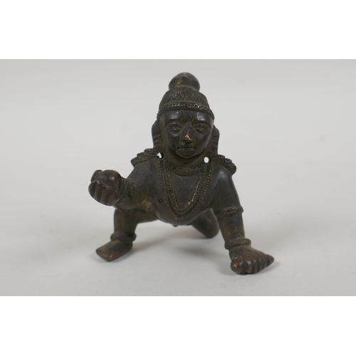 72 - An antique Indian bronze of a crawling figure, 8cm long