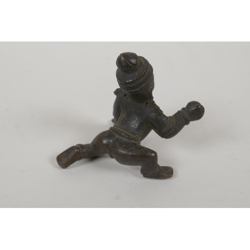 72 - An antique Indian bronze of a crawling figure, 8cm long