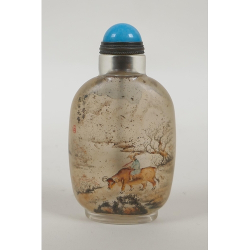 74 - A Chinese reverse decorated glass snuff bottle decorated with figures and buffalo in a landscape, 9c... 