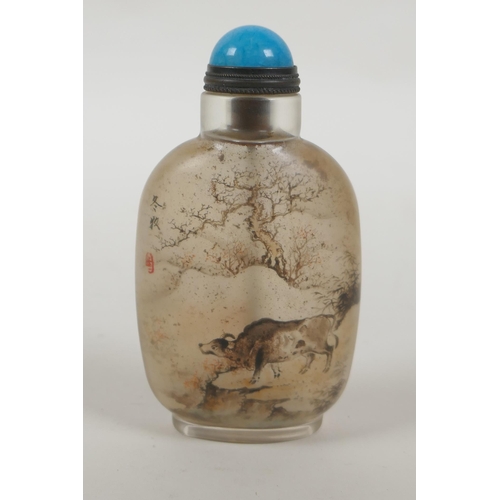 74 - A Chinese reverse decorated glass snuff bottle decorated with figures and buffalo in a landscape, 9c... 