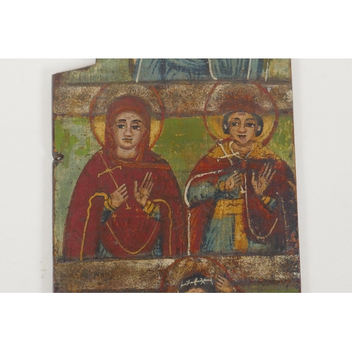 803 - An C18th Greek icon panel from a triptych depicting saints, oil on board, 10 x 29cm