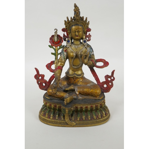 90 - A Tibetan gilt and cold painted metal figure of the goddess Green Tara, 22cm high