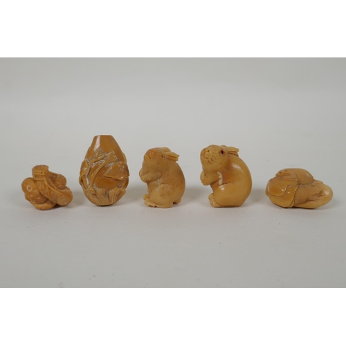 93 - Five Japanese carved tagua nut netsuke in the form of rabbits, mice, lotus flowers and a snake, larg... 