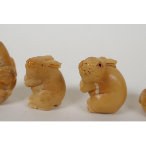 93 - Five Japanese carved tagua nut netsuke in the form of rabbits, mice, lotus flowers and a snake, larg... 