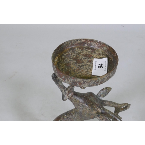 94 - An Eastern patinated bronze censer in the form of a deer, 33cm high