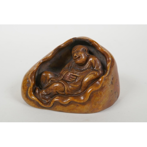 96 - A Chinese soapstone seal with carved Lohan decoration, 10 x 7cm