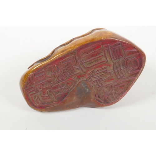 96 - A Chinese soapstone seal with carved Lohan decoration, 10 x 7cm