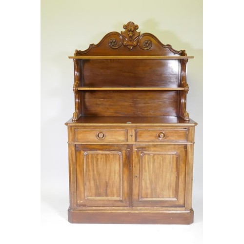 1138 - A C19th mahogany chiffonier, the upper section with two shelves, with carved supports, the lower wit... 