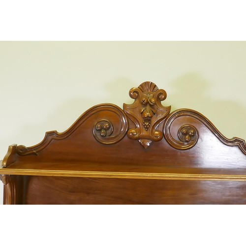 1138 - A C19th mahogany chiffonier, the upper section with two shelves, with carved supports, the lower wit... 