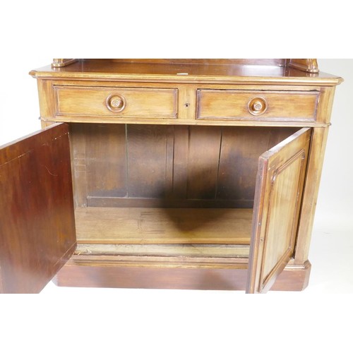 1138 - A C19th mahogany chiffonier, the upper section with two shelves, with carved supports, the lower wit... 