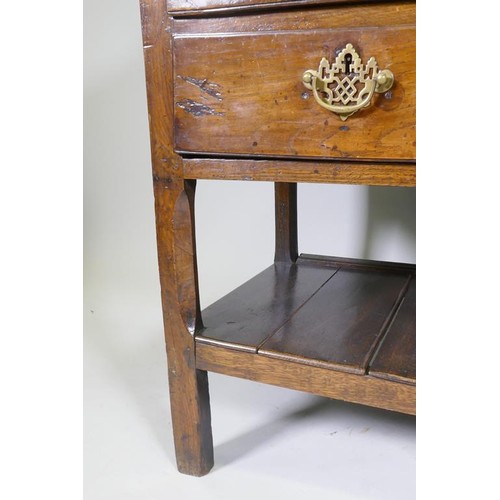 1140 - A good C18th Welsh oak dresser, the enclosed delf rack on a base of five drawers, the middle opening... 