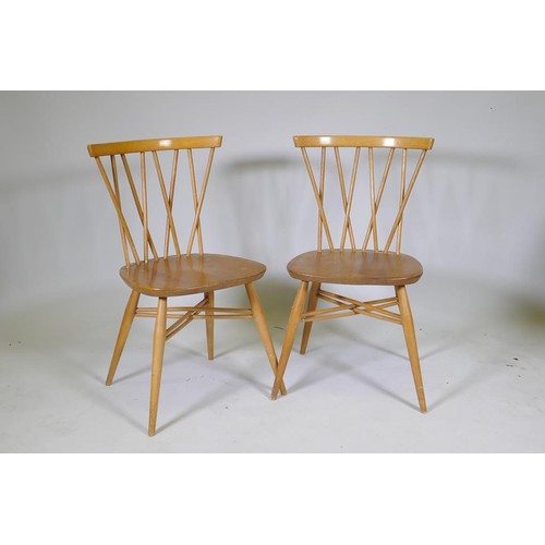 1142 - A pair of Ercol Shalstone chairs with elm seats