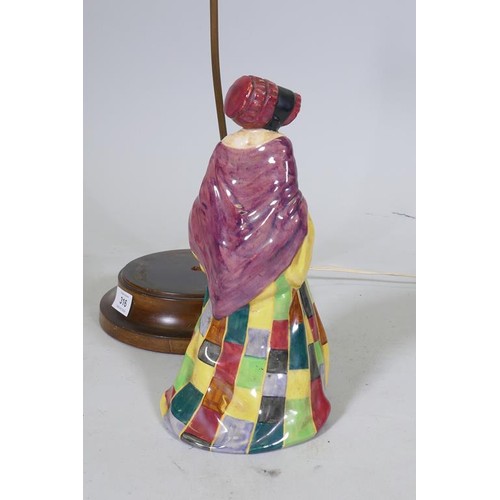 316 - A Royal Doulton 'The Parson's Daughter' porcelain table lamp, marked No HN564, mounted on a wood bas... 