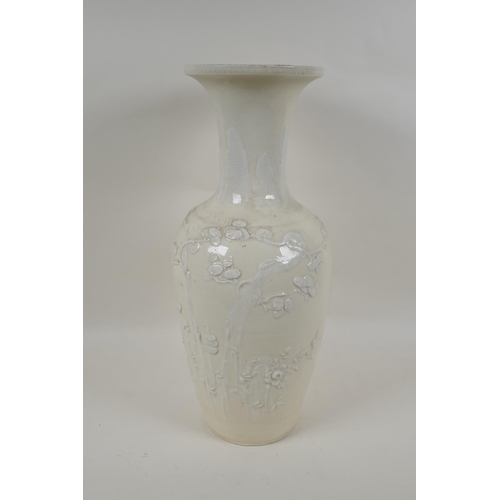 90 - A C19th Chinese blanc de chine porcelain vase, with raised decoration of deer and crane in a landsca... 