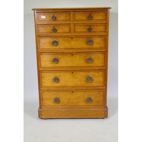 1001 - A Victorian polished pine chest of drawers with original painted decoration, four over four drawers ... 