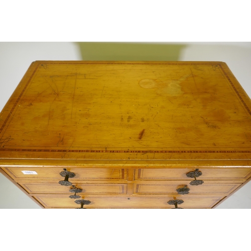 1001 - A Victorian polished pine chest of drawers with original painted decoration, four over four drawers ... 