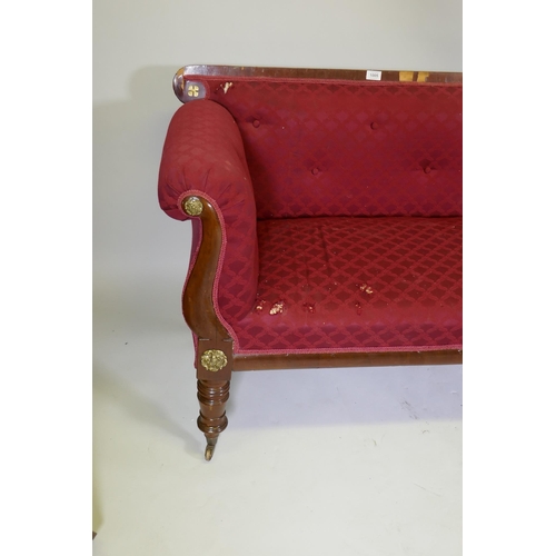 1005 - A C19th Continental mahogany settee, with scrolled arms and brass mounts, raised on turned supports,... 