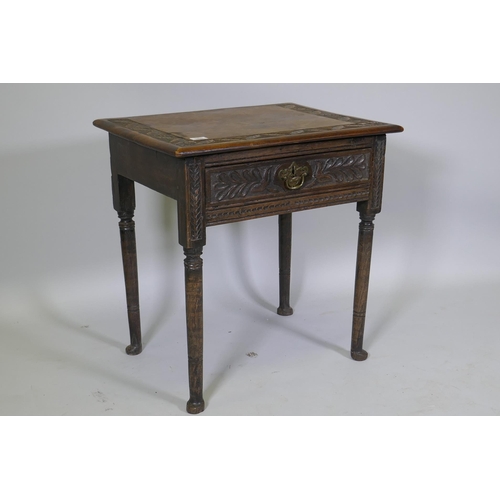 1008 - A Georgian oak single drawer side table with carved, raised on turned supports with pad feet, 66 x 4... 