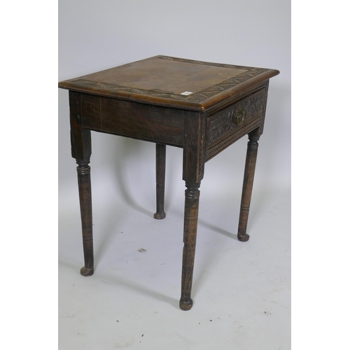 1008 - A Georgian oak single drawer side table with carved, raised on turned supports with pad feet, 66 x 4... 