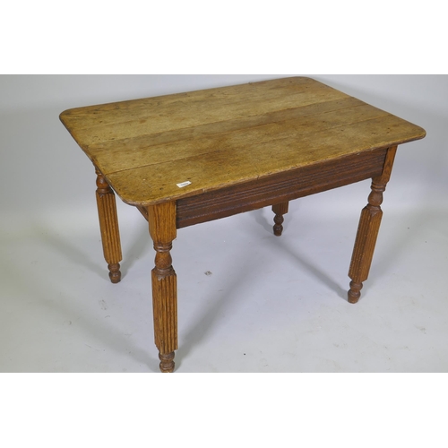 1009 - An antique continental oak plank top table, raised on reeded supports, 103 x 74 x 74cm