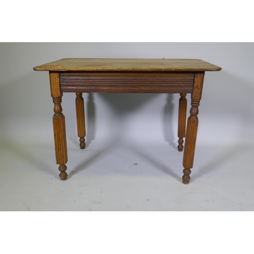 1009 - An antique continental oak plank top table, raised on reeded supports, 103 x 74 x 74cm