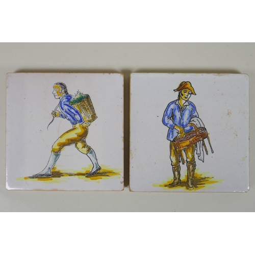 101 - A pair of antique faience tiles decorated with trades people, 14 x 14cm