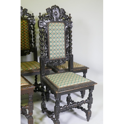 1012 - A set of five Jacobean style carved oak highback chairs