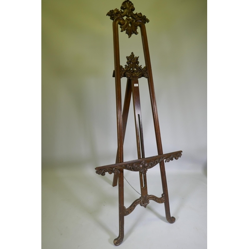 1017 - A carved mahogany adjustable easel, 220cm high