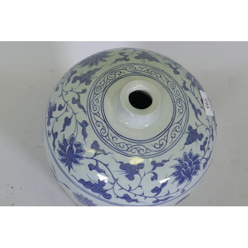 102 - A Chinese blue and white ceramic vase decorated with fish amongst reeds, 42cm high