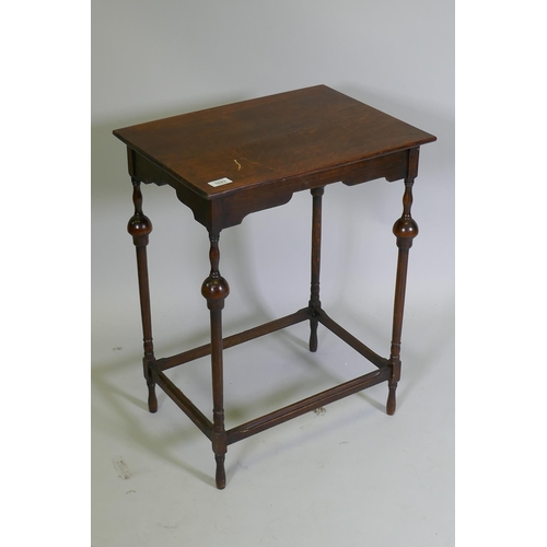 1023 - A Queen Anne style oak lamp table, raised on slender supports with baluster shaped detail, 50 x 38 x... 