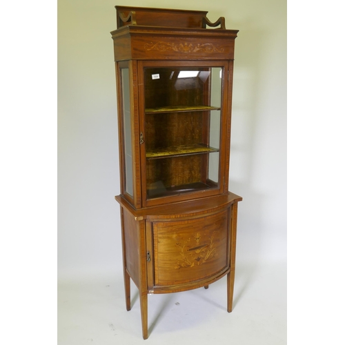 1024 - A Victorian inlaid mahogany bow front display cabinet raised on tapering supports, 67 x 45cm, 183cm ... 