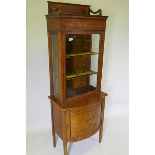 1024 - A Victorian inlaid mahogany bow front display cabinet raised on tapering supports, 67 x 45cm, 183cm ... 