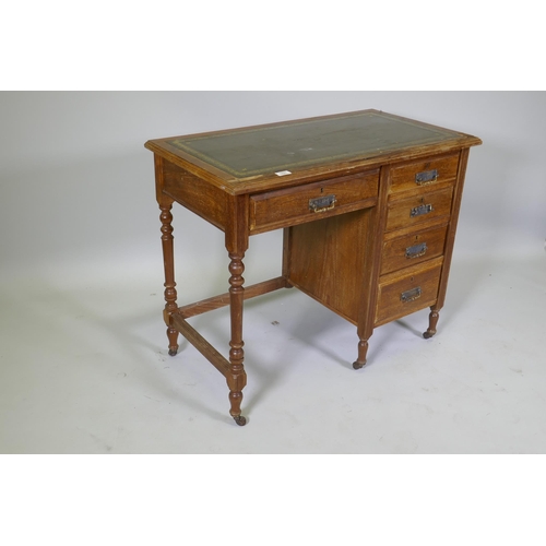 1027 - A Victorian mahogany five drawer desk, with leather inset top, raised on turned supports with castor... 