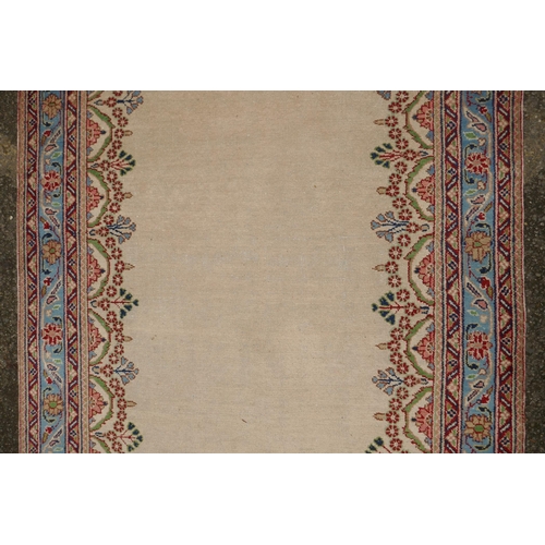 1033 - An Oriental cream ground hand woven wool runner with blue border and floral designs, 150 x 600cm