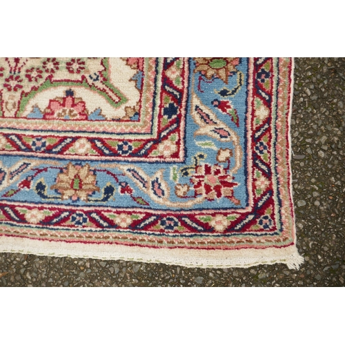 1033 - An Oriental cream ground hand woven wool runner with blue border and floral designs, 150 x 600cm