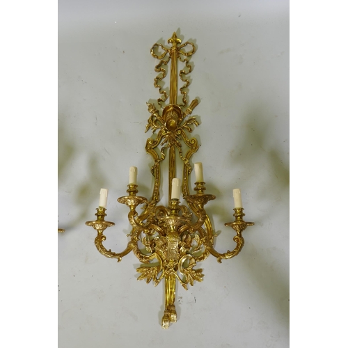 1034 - A pair of ormolu five branch sconces decorated with swags, masks and torches etc 119cm 